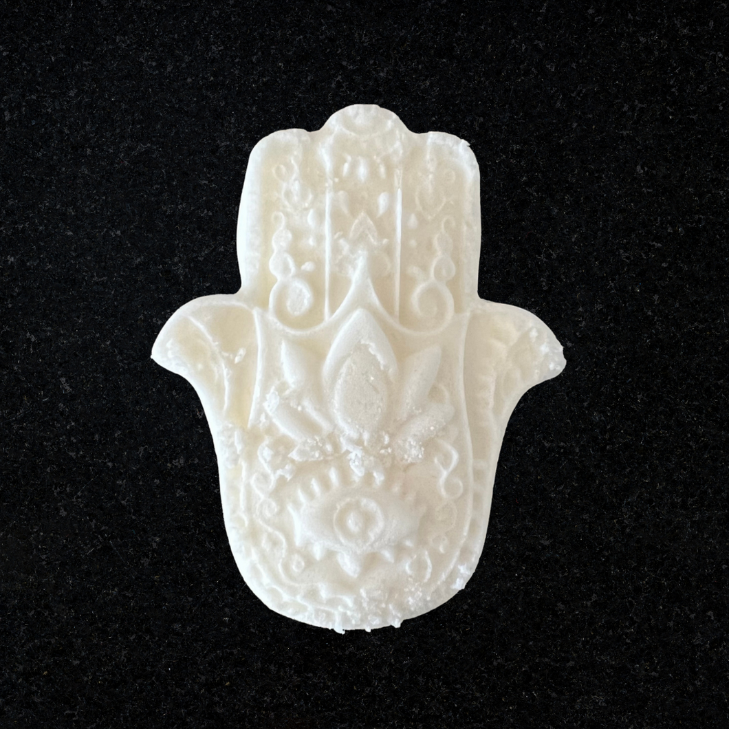 Hamsa bath bomb with lotus and evil eye with intricate design.